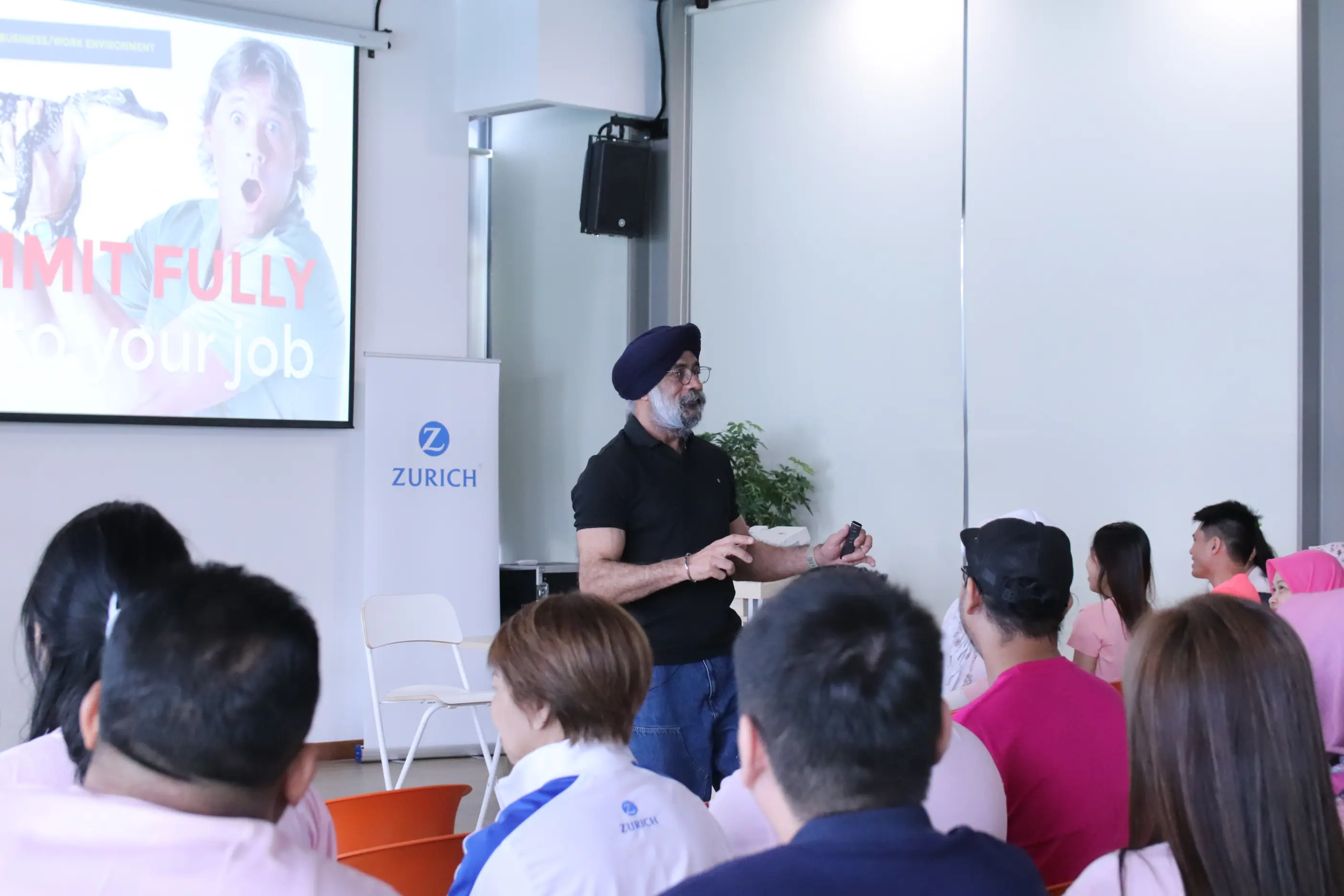 A Learning Edge facilitator presenting to a corporate audience during a client training session